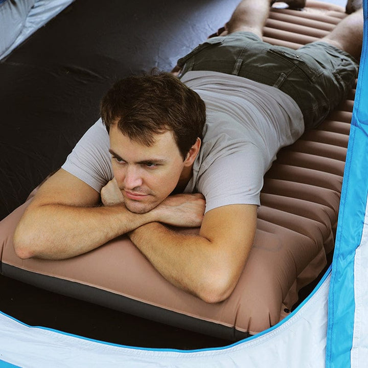 Matelas gonflable premium avec coussin intégré. Confort optimal pour une nuit paisible, camping ou voyage.