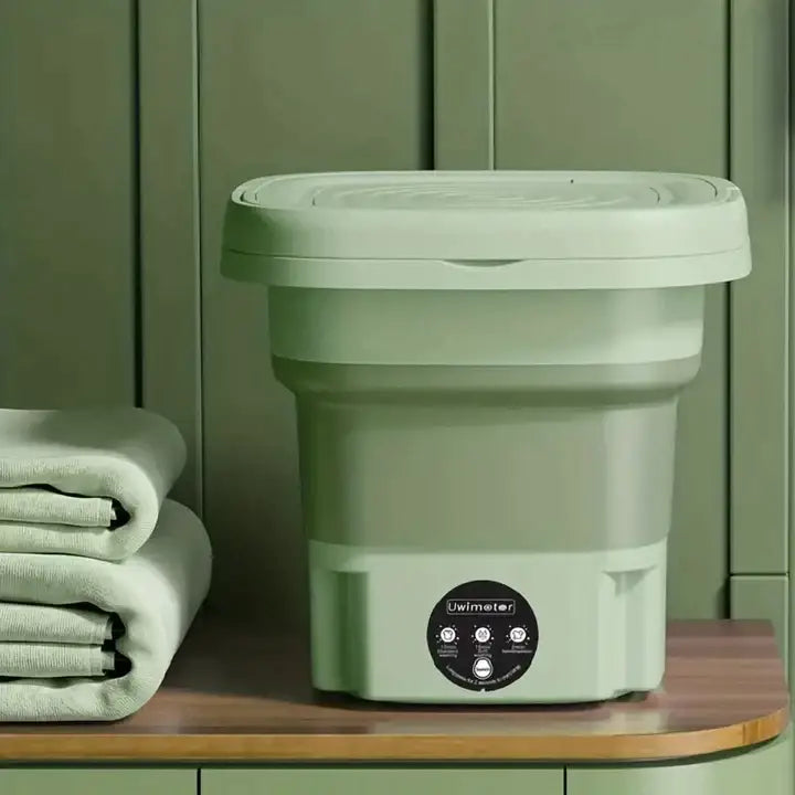 "Mini machine à laver portable violette, compacte et pliable, design moderne, lavage efficace et transport facile."