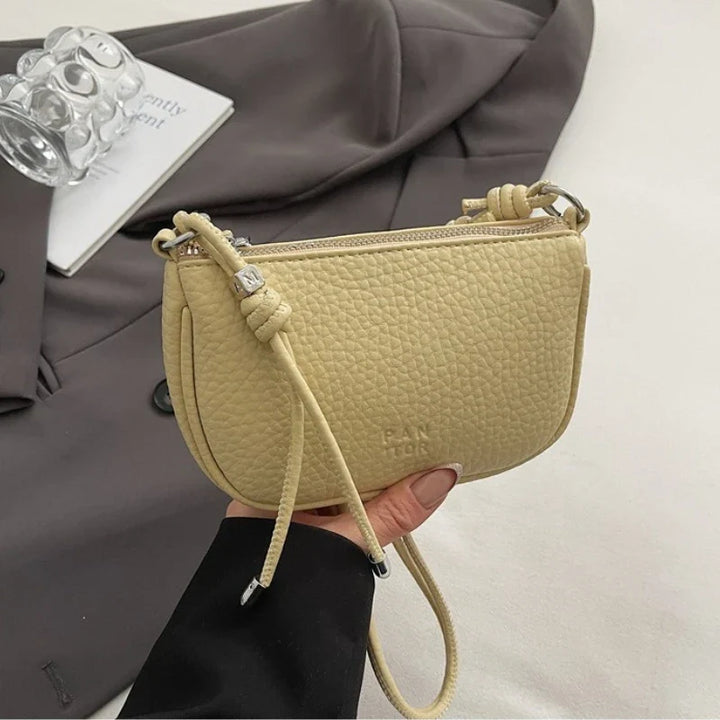 Mini sac à main femme, élégant et compact, en similicuir, avec bandoulière, un accessoire de mode indispensable.