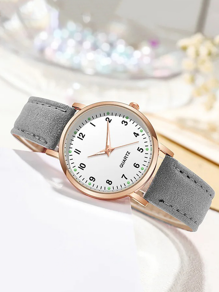 Montre quartz femme avec boîtier or rose et bracelet en cuir. Style tendance et raffiné pour elle.