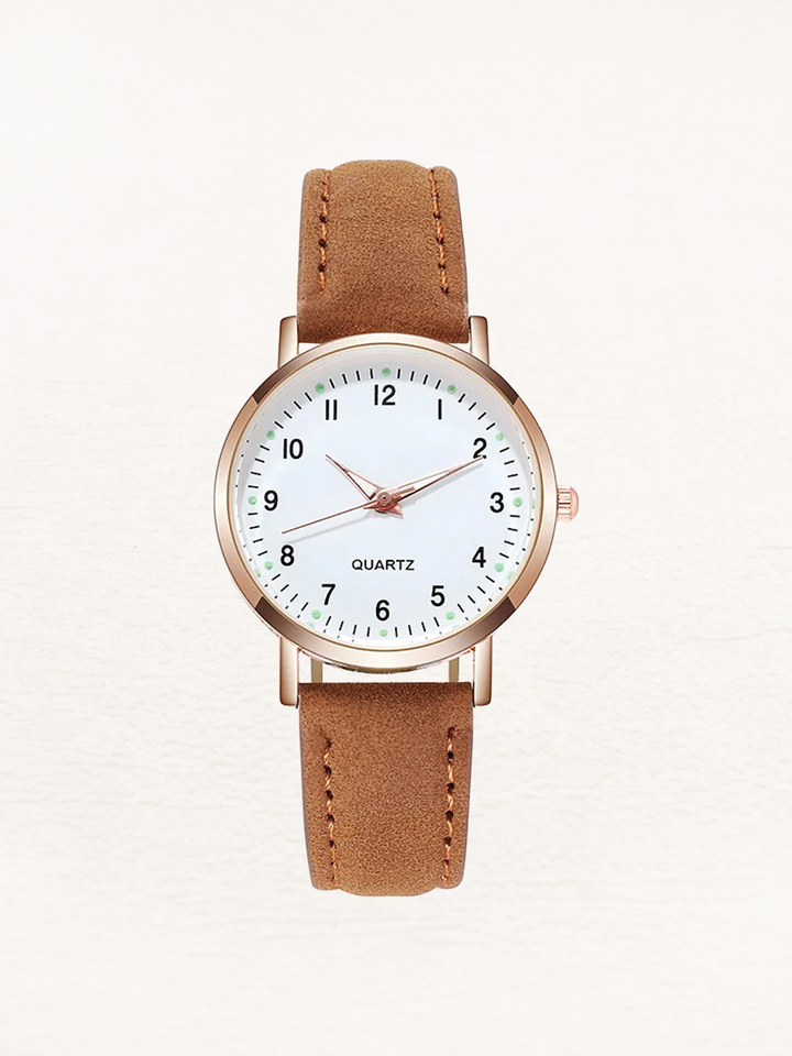 Montre femme chic, bracelet cuir et touches or rose. Mouvement quartz précis, un must-have tendance.