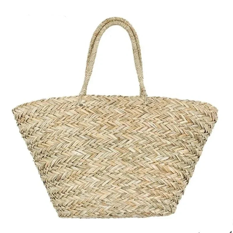 Sac à main cabas artisanal en paille naturelle, parfait pour la plage ou les balades estivales.