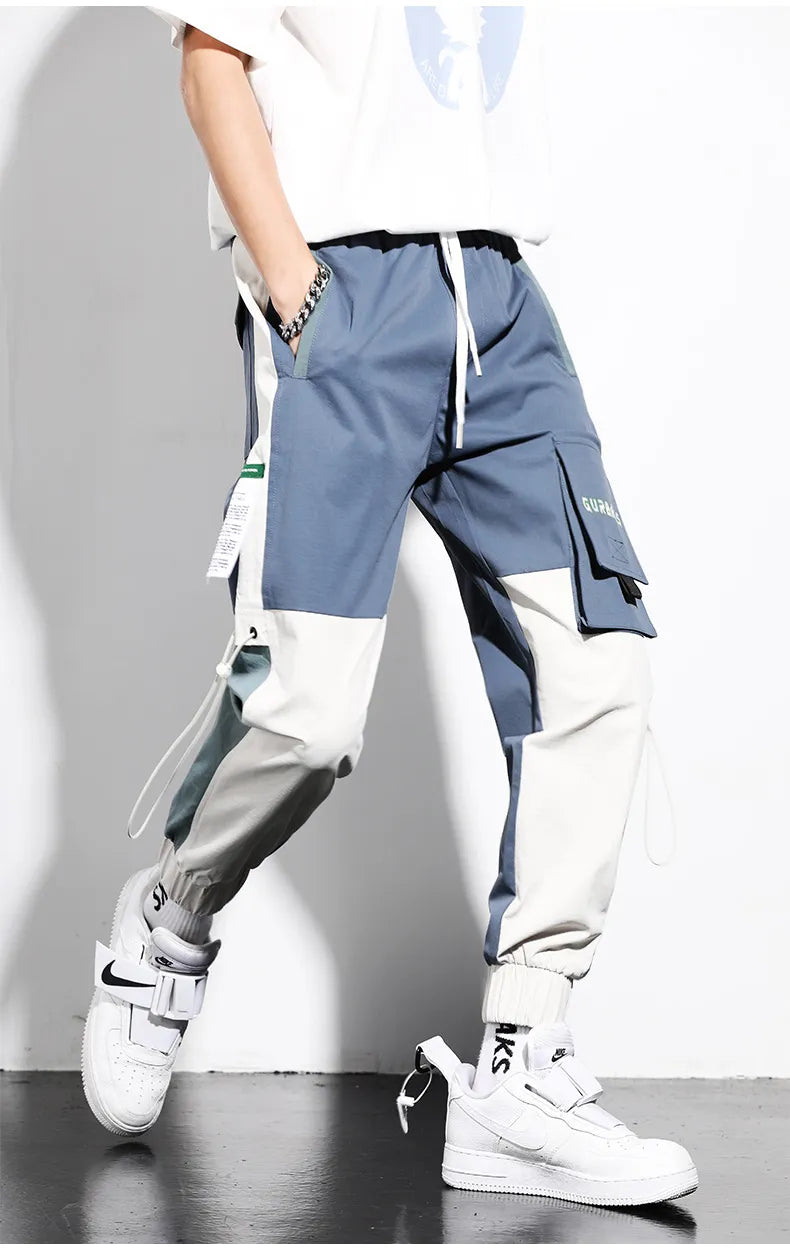 Pantalon cargo bicolore pour hommes, style urbain streetwear tendance avec poches utilitaires.