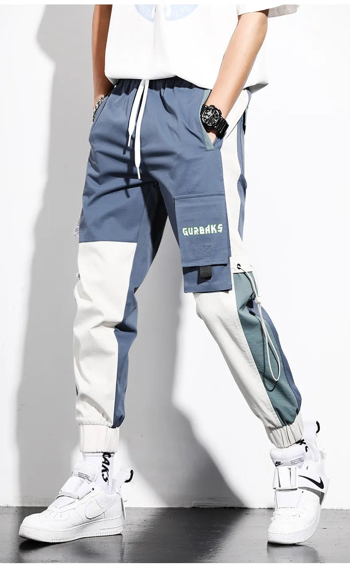 Pantalon cargo bicolore décontracté pour hommes, esprit jogger, collection printemps-été, style sportswear urbain.