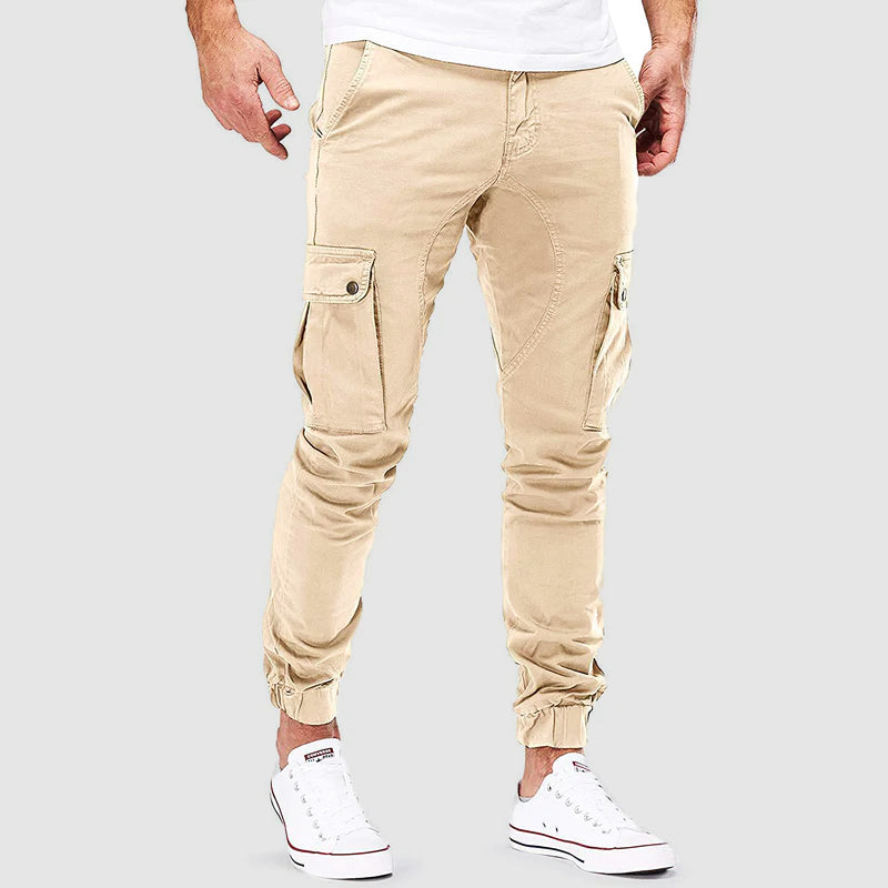 Pantalon cargo homme Alonso avec poches multiples, coupe ajustée, bord élastique pour confort urbain et style décontracté.