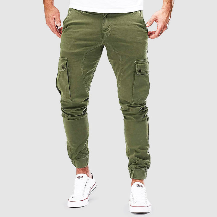 Pantalon cargo homme Alonso avec poches multiples, coupe ajustée, bord élastique pour confort urbain et style décontracté.