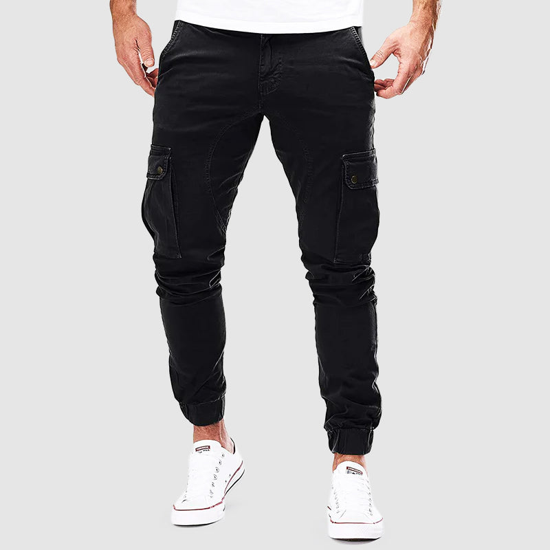Pantalon cargo homme Alonso avec poches multiples, coupe ajustée, bord élastique pour confort urbain et style décontracté.