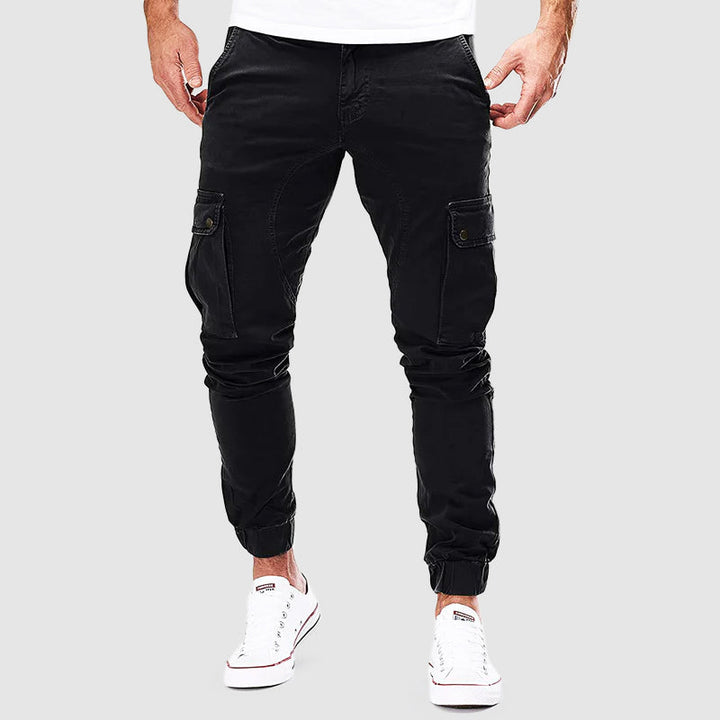 Pantalon cargo homme Alonso avec poches multiples, coupe ajustée, bord élastique pour confort urbain et style décontracté.