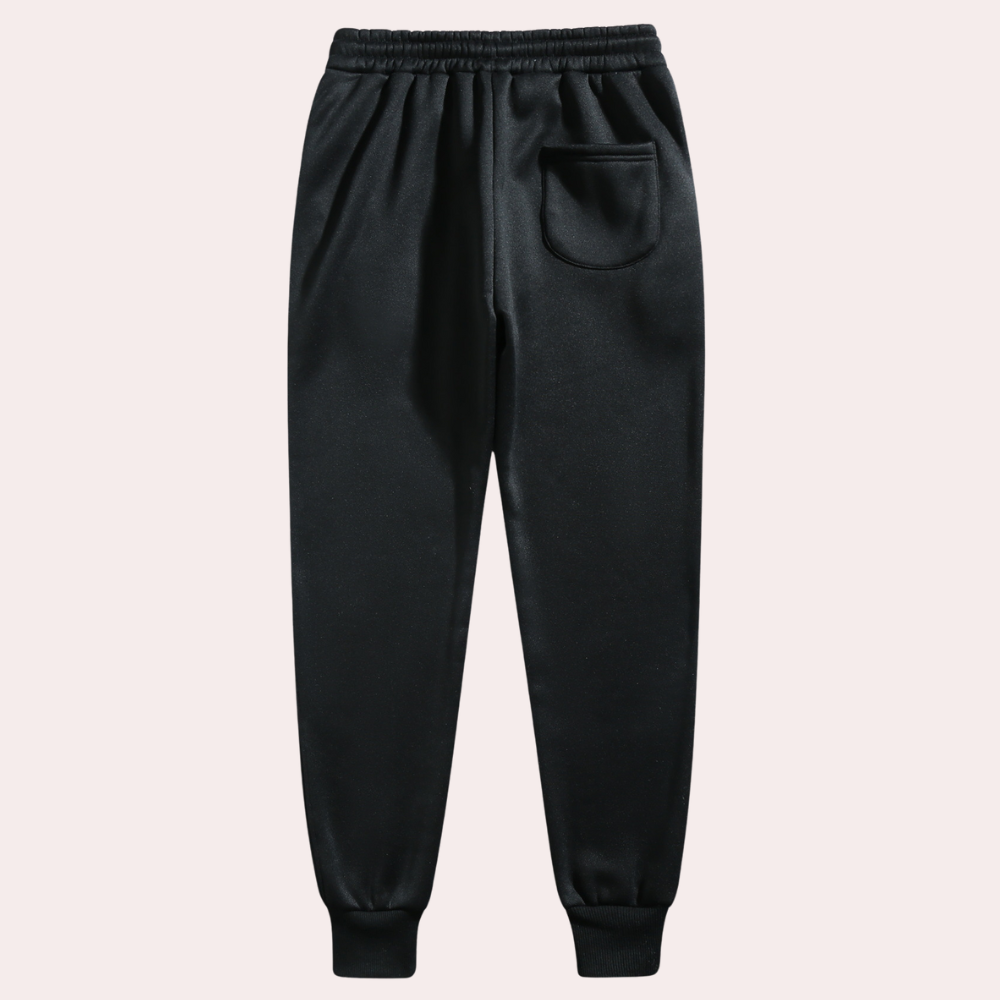 Jogging noir homme décontracté avec cordon de serrage, idéal pour le sport et le confort quotidien.