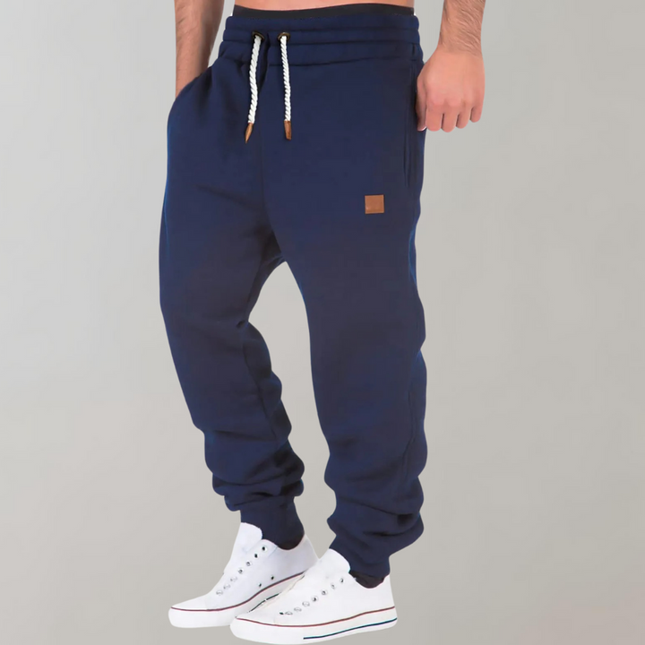 Pantalon de jogging homme décontracté noir, polyvalent pour le sport et le style urbain.