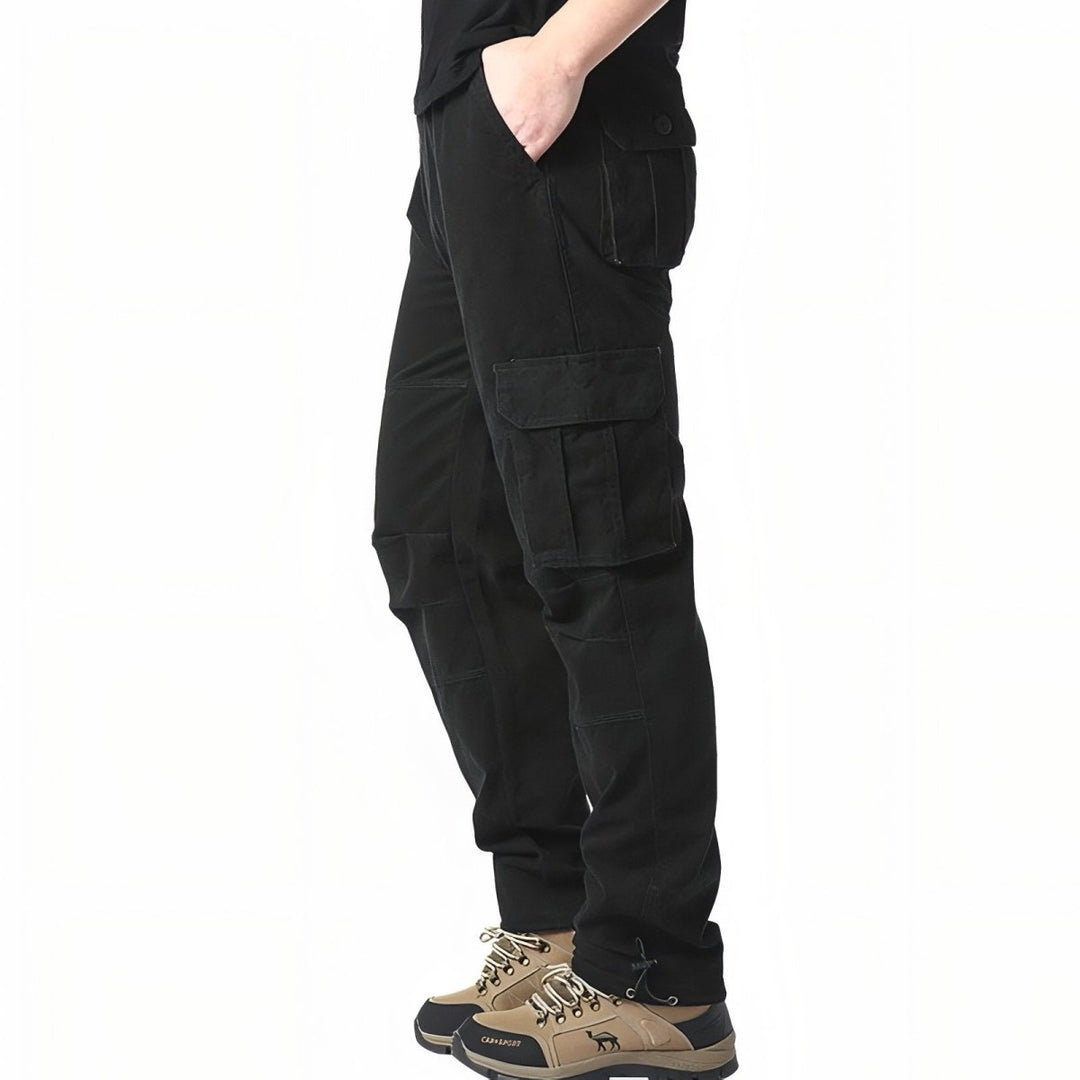 "Pantalon de randonnée respirant gris avec poches cargo et taille élastique, idéal pour trekking en plein air."