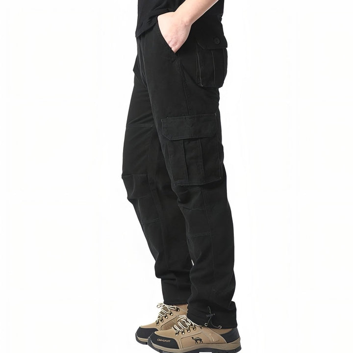 "Pantalon de randonnée respirant gris avec poches cargo et taille élastique, idéal pour trekking en plein air."
