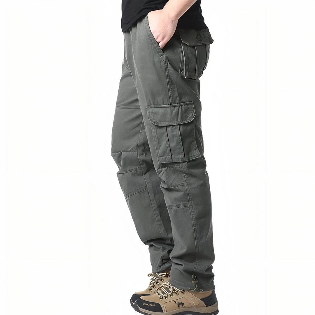 "Pantalon de randonnée respirant gris avec poches cargo et taille élastique, idéal pour trekking en plein air."
