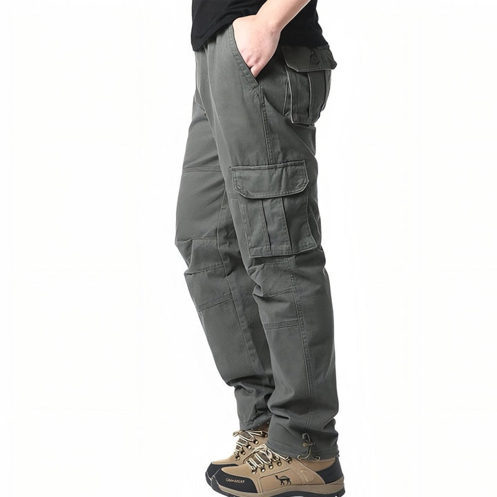 "Pantalon de randonnée respirant gris avec poches cargo et taille élastique, idéal pour trekking en plein air."