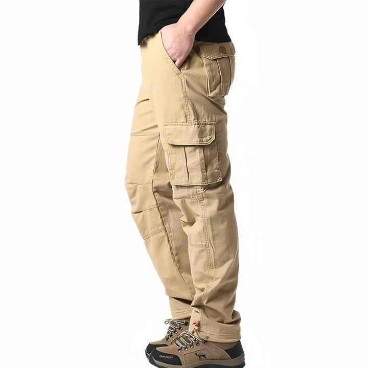 "Pantalon de randonnée respirant gris avec poches cargo et taille élastique, idéal pour trekking en plein air."