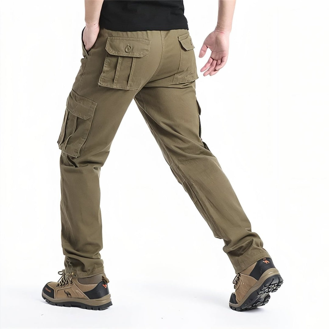 "Pantalon de randonnée respirant gris avec poches cargo et taille élastique, idéal pour trekking en plein air."