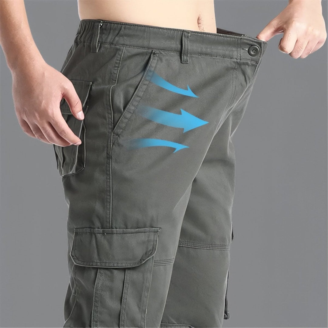 "Pantalon de randonnée respirant gris avec poches cargo et taille élastique, idéal pour trekking en plein air."