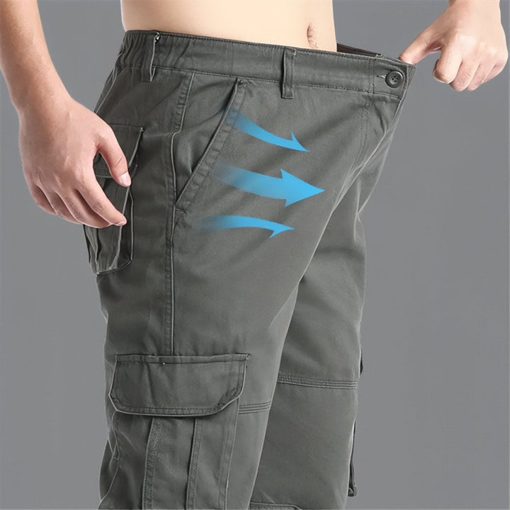 "Pantalon de randonnée respirant gris avec poches cargo et taille élastique, idéal pour trekking en plein air."