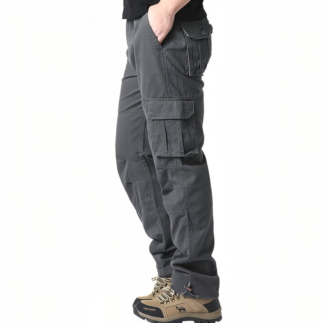 "Pantalon de randonnée respirant gris avec poches cargo et taille élastique, idéal pour trekking en plein air."