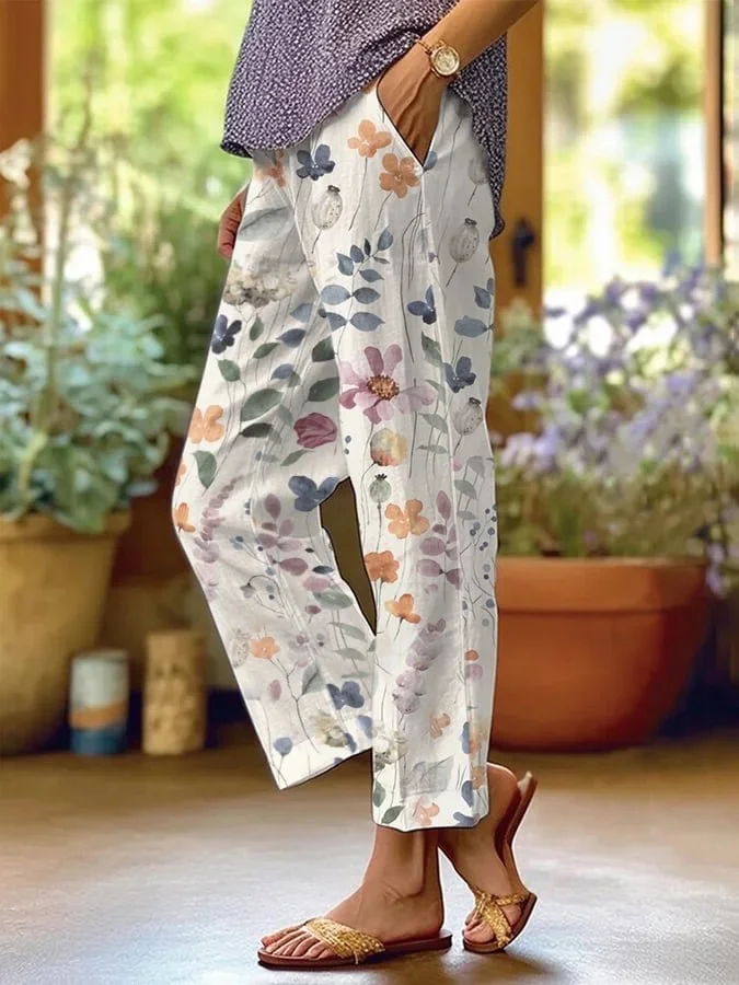 Pantalon décontracté femme à imprimé fleuri vibrant, coupe ample, taille élastique, confortable pour style estival chic.