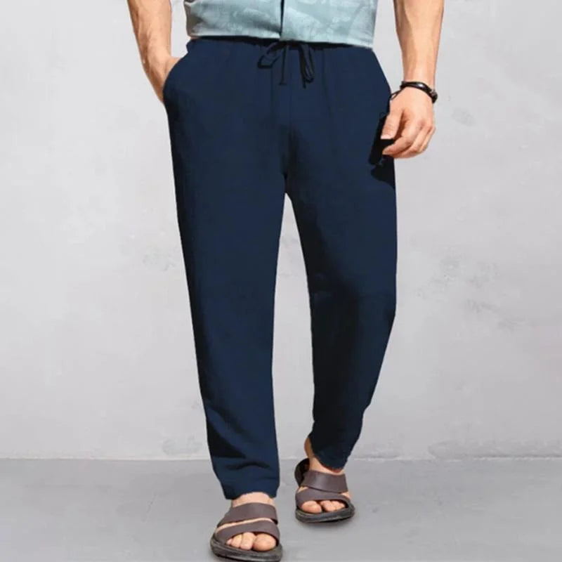 "Pantalon d'été homme lin, léger et respirant, coupe décontractée, idéal journées chaudes, look simple et élégant."