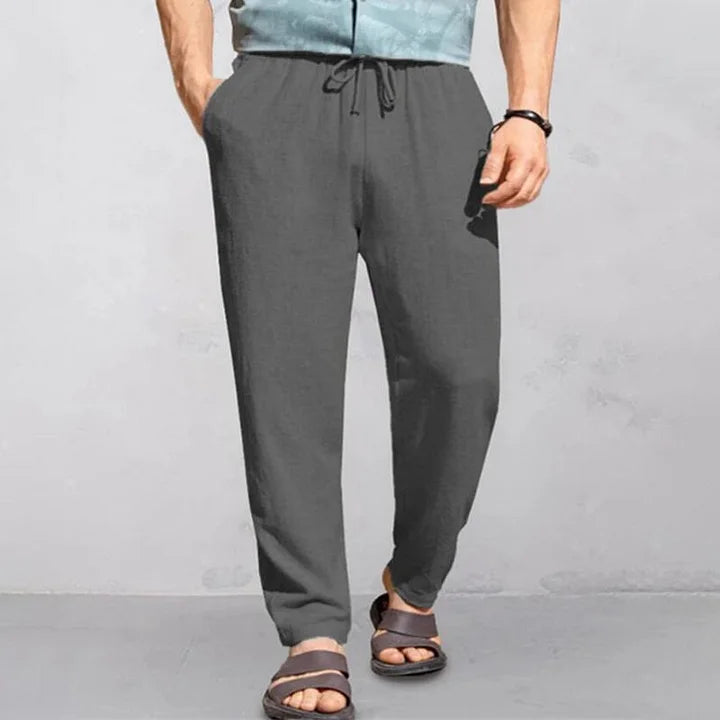 "Pantalon d'été homme lin, léger et respirant, coupe décontractée, idéal journées chaudes, look simple et élégant."