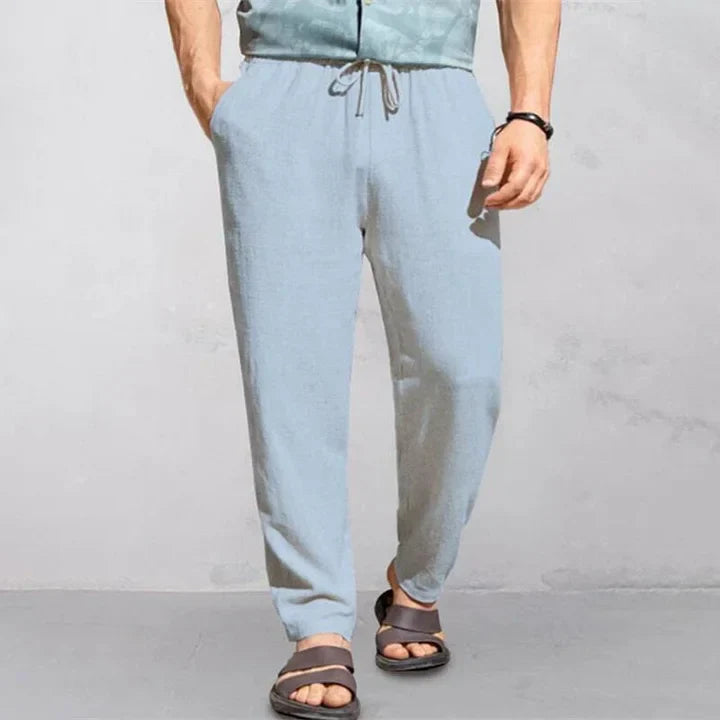 "Pantalon d'été homme lin, léger et respirant, coupe décontractée, idéal journées chaudes, look simple et élégant."