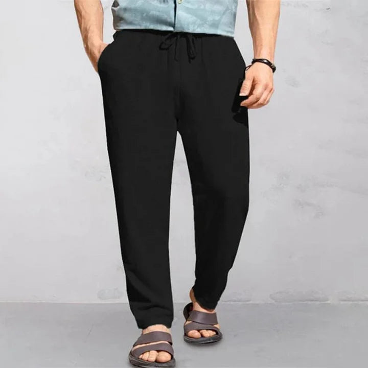"Pantalon d'été homme lin, léger et respirant, coupe décontractée, idéal journées chaudes, look simple et élégant."