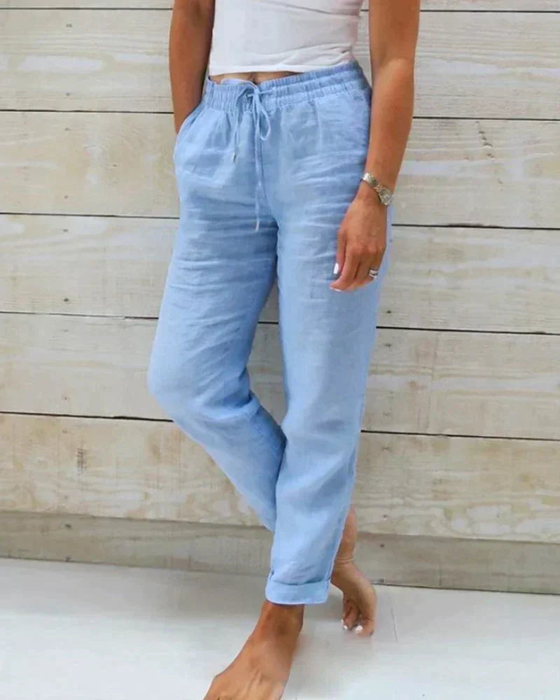 Pantalon en lin femme élégant, respirant, couleur beige, coupe flatteuse, idéal pour confort et style estival.