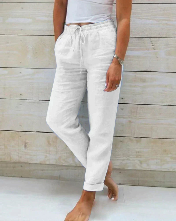 Pantalon en lin femme élégant, respirant, couleur beige, coupe flatteuse, idéal pour confort et style estival.