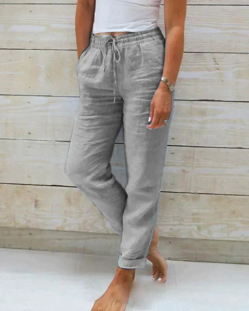 Pantalon en lin femme élégant, respirant, couleur beige, coupe flatteuse, idéal pour confort et style estival.
