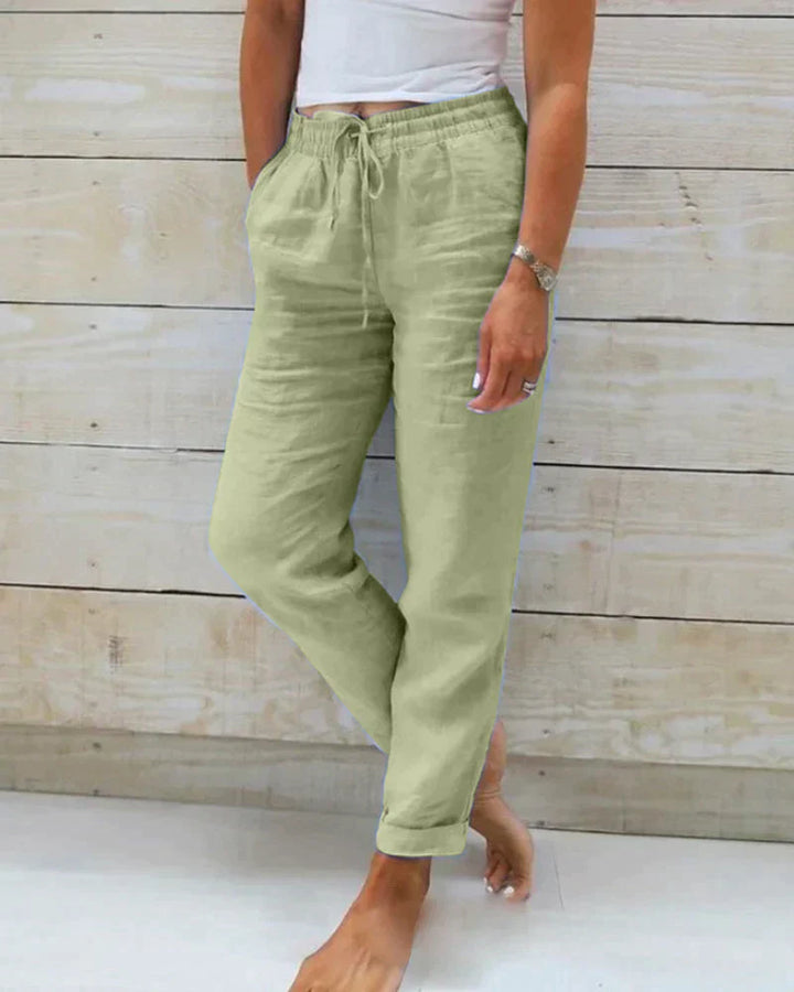 Pantalon en lin femme élégant, respirant, couleur beige, coupe flatteuse, idéal pour confort et style estival.