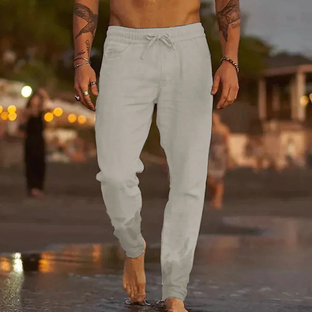 "Pantalon en lin homme, coupe ample, léger, gris clair, taille élastique, style chic et décontracté parfait pour l'été."