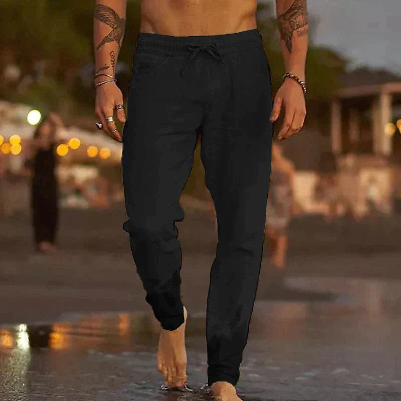 "Pantalon en lin homme, coupe ample, léger, gris clair, taille élastique, style chic et décontracté parfait pour l'été."