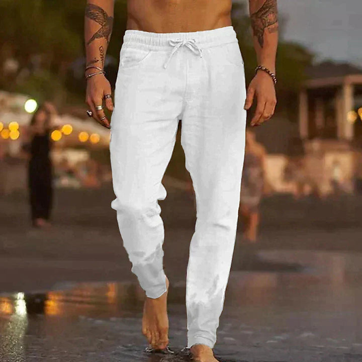 "Pantalon en lin homme, coupe ample, léger, gris clair, taille élastique, style chic et décontracté parfait pour l'été."