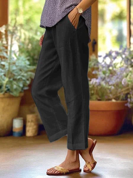 Pantalon en lin léger blanc pour femme, coupe fluide, taille élastique, idéal pour l'été et un confort optimal.