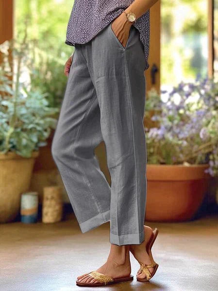 Pantalon en lin léger blanc pour femme, coupe fluide, taille élastique, idéal pour l'été et un confort optimal.