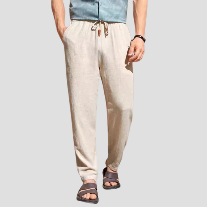 Pantalon en lin pour homme, coupe droite fluide, tissu respirant, cordon ajustable, style décontracté et élégant.