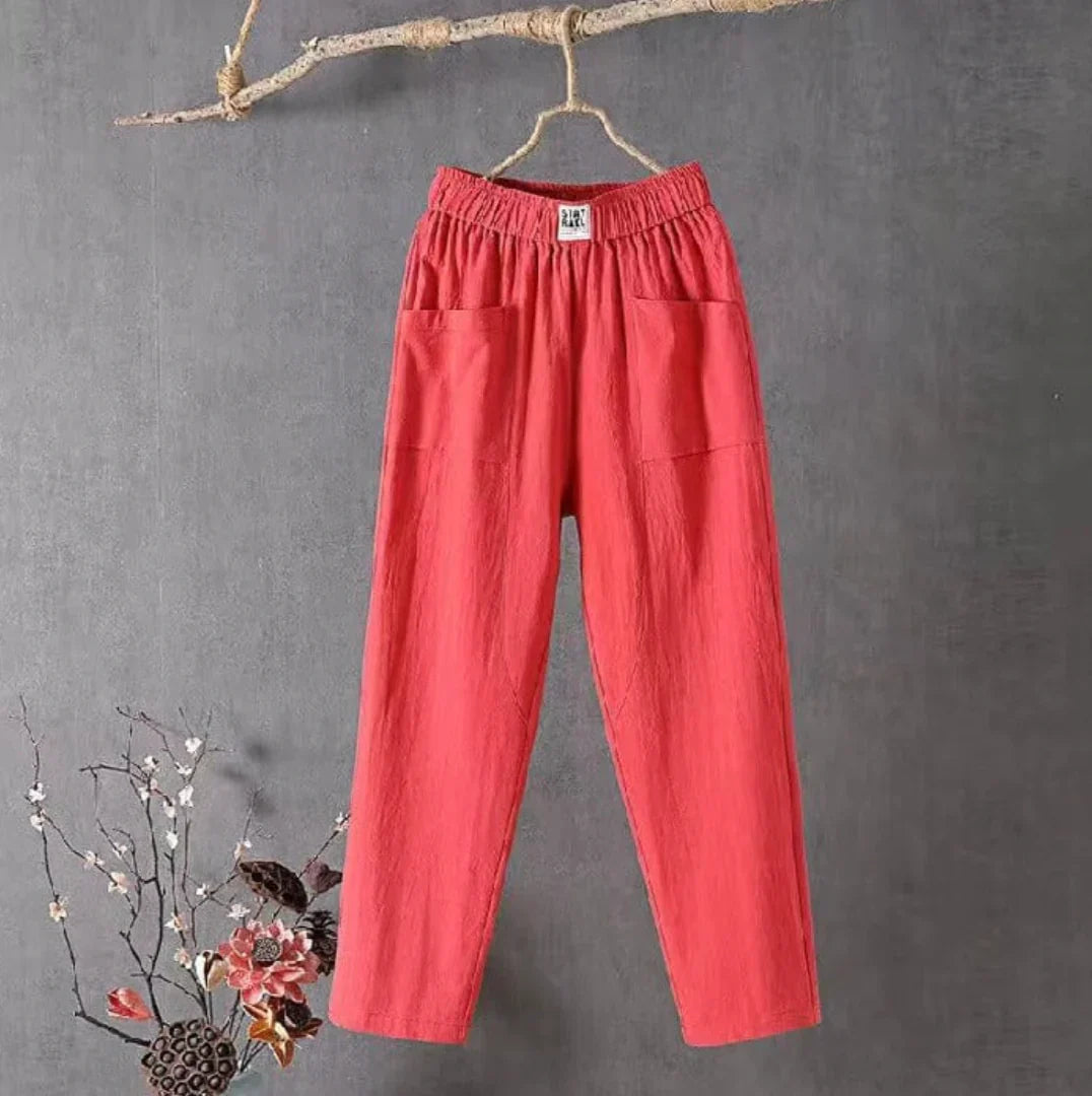 Pantalon femme fluide en lin/coton avec taille élastique et poches, parfait pour un look décontracté.
