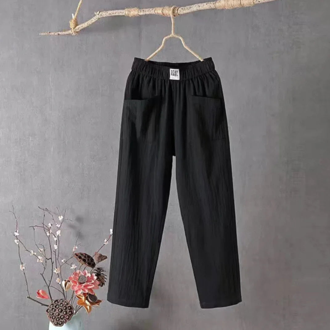 Pantalon femme ample en mélange coton-lin, style décontracté et aéré, parfait pour les saisons chaudes.