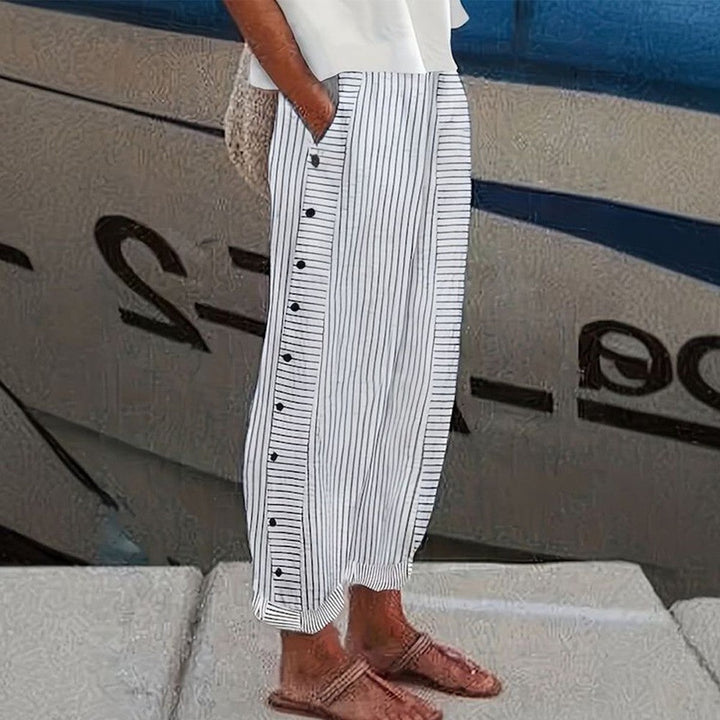 Pantalon femme Pia à coupe ample et décontractée, avec poches latérales pratiques. Confortable et élégant.