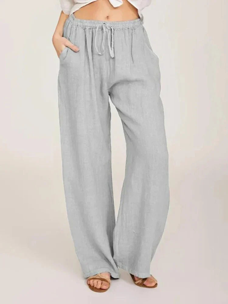 Pantalon femme élégant en lin et coton, coupe féminine, couleur noire, confort chic pour une allure raffinée.