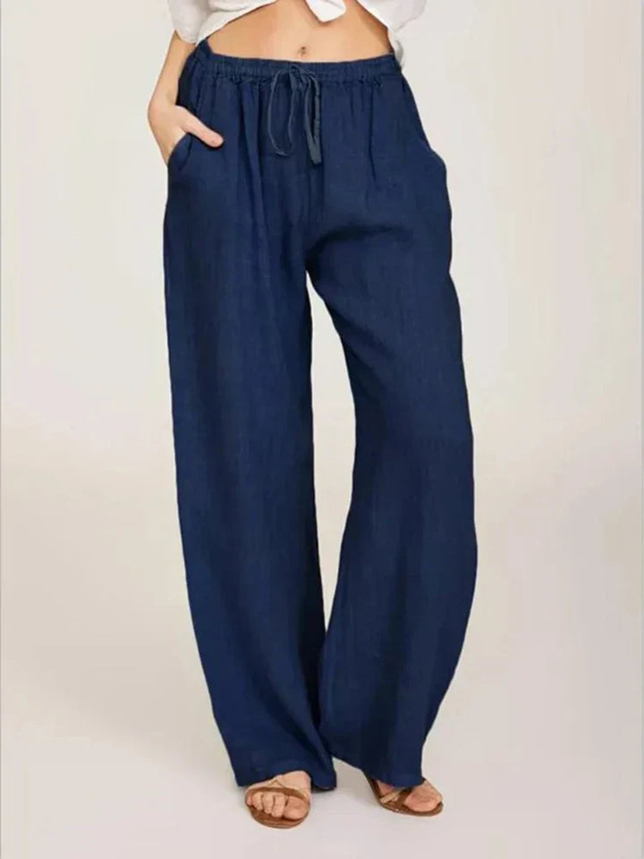 Pantalon femme élégant en lin et coton, coupe féminine, couleur noire, confort chic pour une allure raffinée.