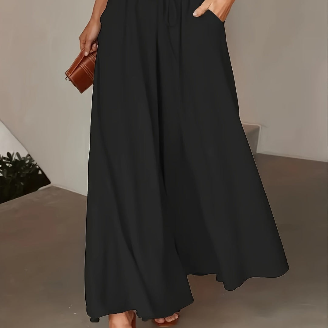Pantalon femme noir taille élastique, coupe jambe large, pour un confort optimal et un style élégant sans effort.