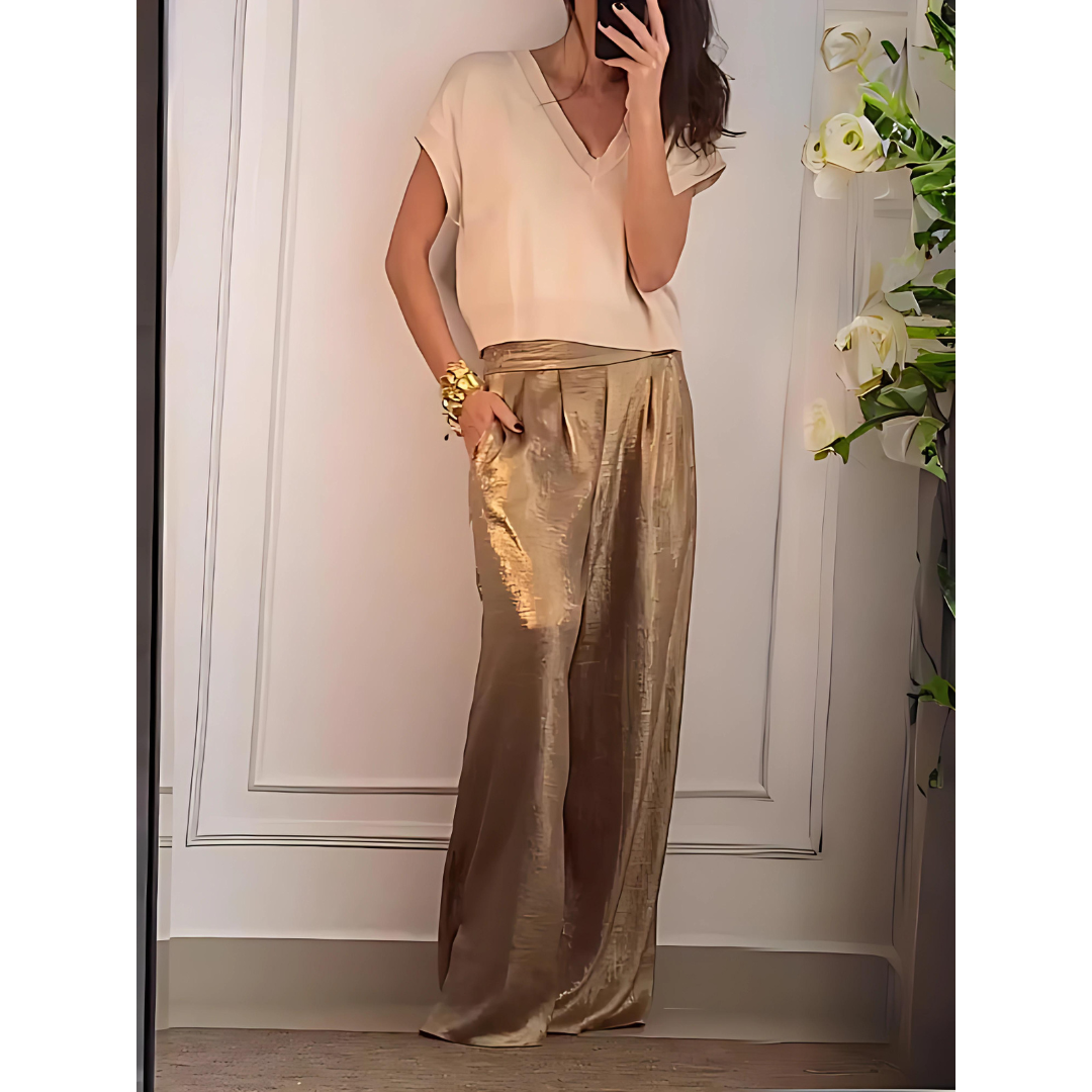 Pantalon femme élégant taille haute, coupe large fluide pour un style chic et confortable.