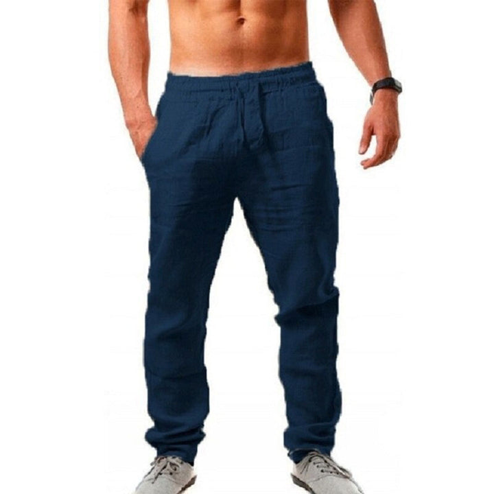 Pantalon homme fluide uni, polyvalent printemps-été. Élégant ou décontracté, confort assuré.