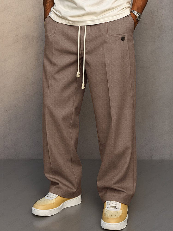 Pantalon homme à taille élastique, coupe ample en coton, parfait pour un style décontracté.