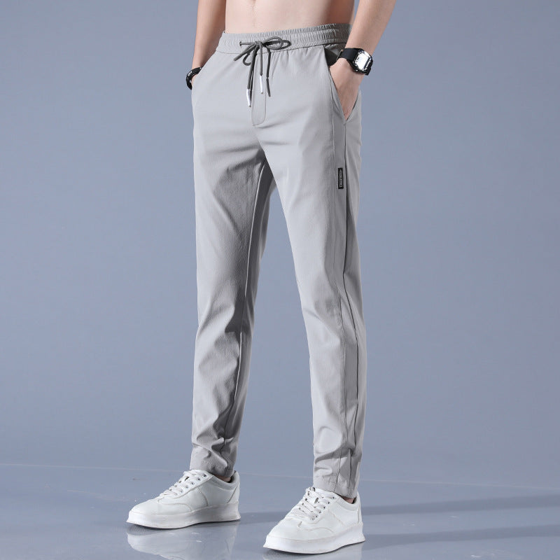 "Pantalon homme réversible, design élégant, tissu stretch, confort pour golf, léger et respirant, couleur neutre."