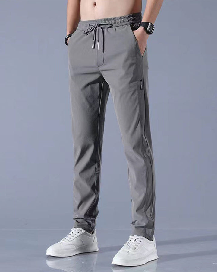 Pantalon homme, séchage rapide, flexible. Coupe moderne et confortable, idéal sport et loisirs.