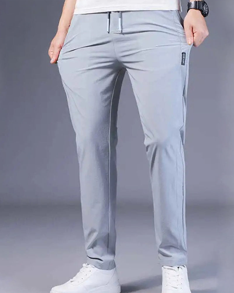 Pantalon homme, séchage rapide, flexible. Coupe moderne et confortable, idéal sport et loisirs.